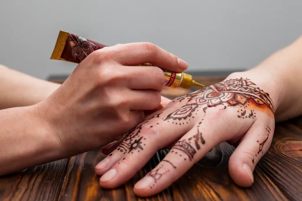Hand Henna Design by Helena at Scarlette Rose Salon Abu Dhabi. Choose from intricate front, back, or half-hand designs.